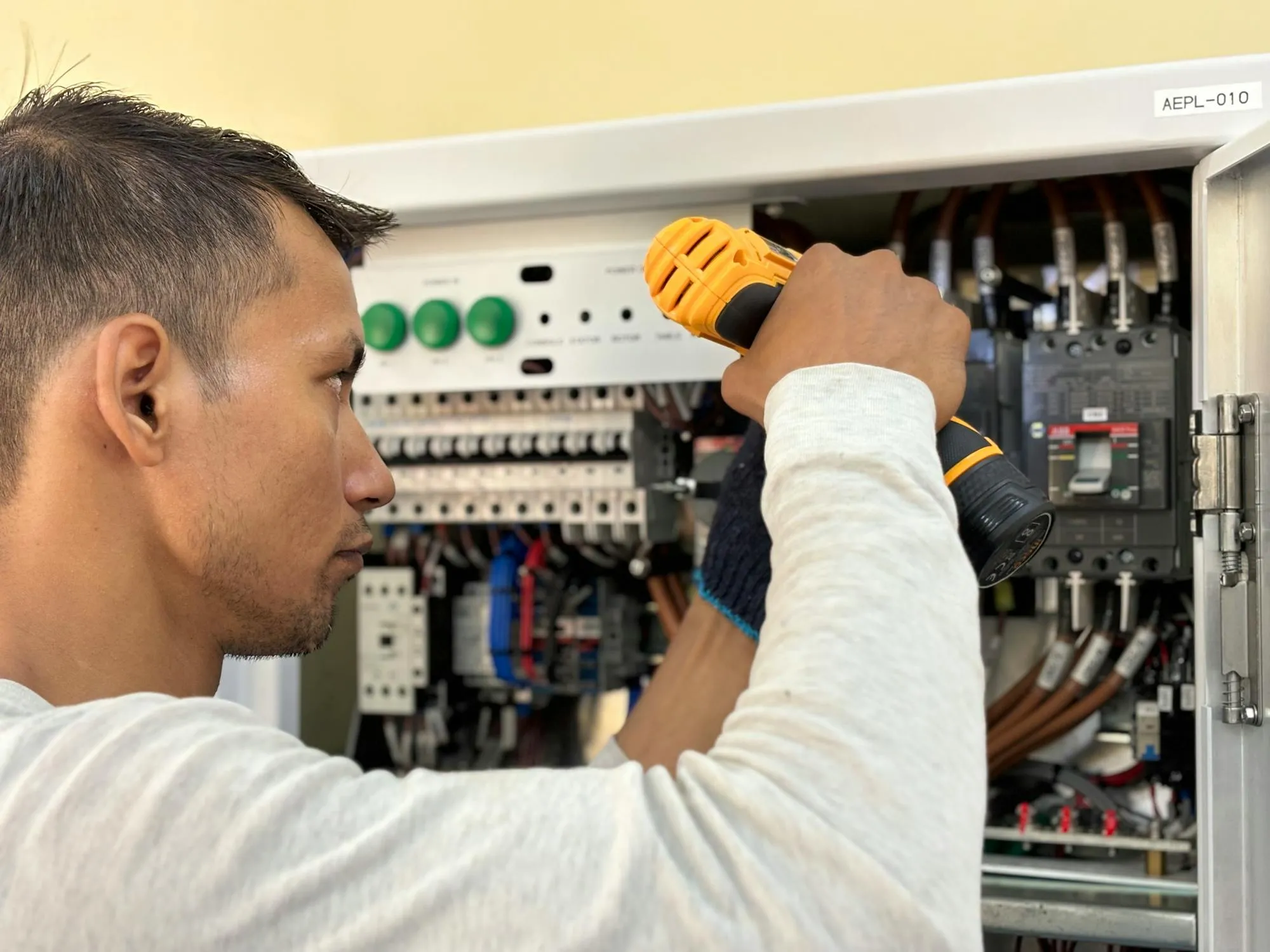 An electrician fitting a modern consumer unit on a residential job in Coventry